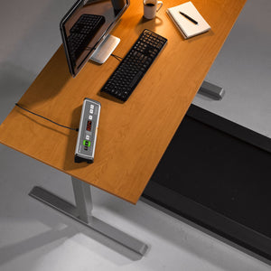 Lifespan TR1200 under desk treadmill with DT3 standing desk console in place at a desk