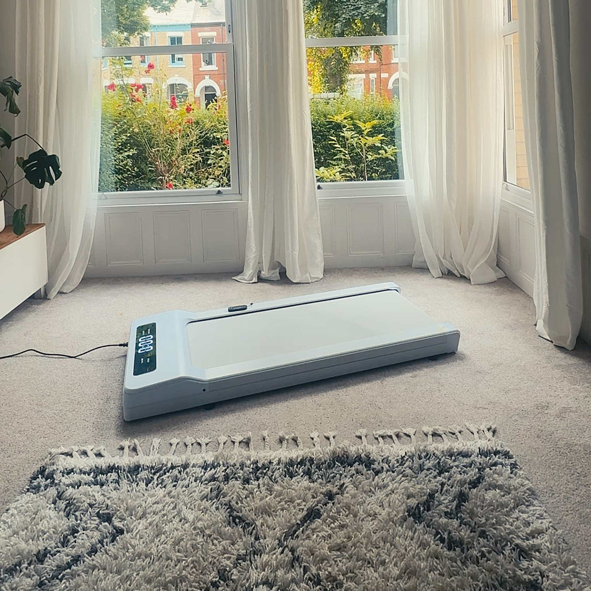 Lifespan Walking Pad - Showing the Treadmill in the living room - White Colour