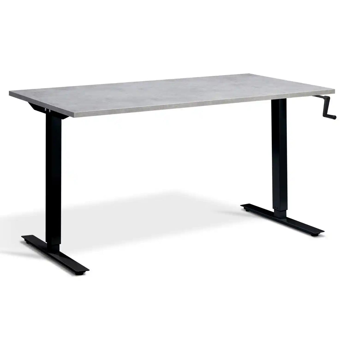 Manual crank standing desk with a light concrete desk top, black frame and hand-operated crank