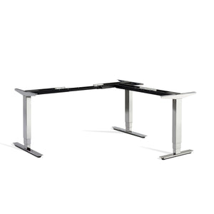 Polished chrome corner sit stand desk frame viewed from the front