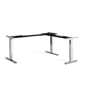 Polished chrome corner adjustable desk frame viewed from the front