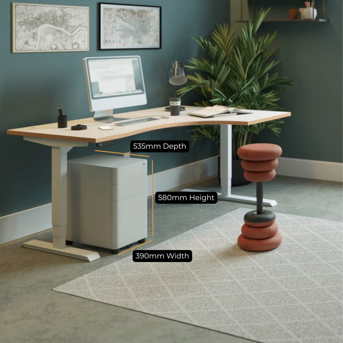 Moda Plus under desk pedestal positioned beneath a standing desk with dimensions shown