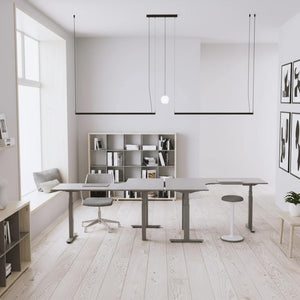 2 left hand return corner standing desks in an office placed side by side