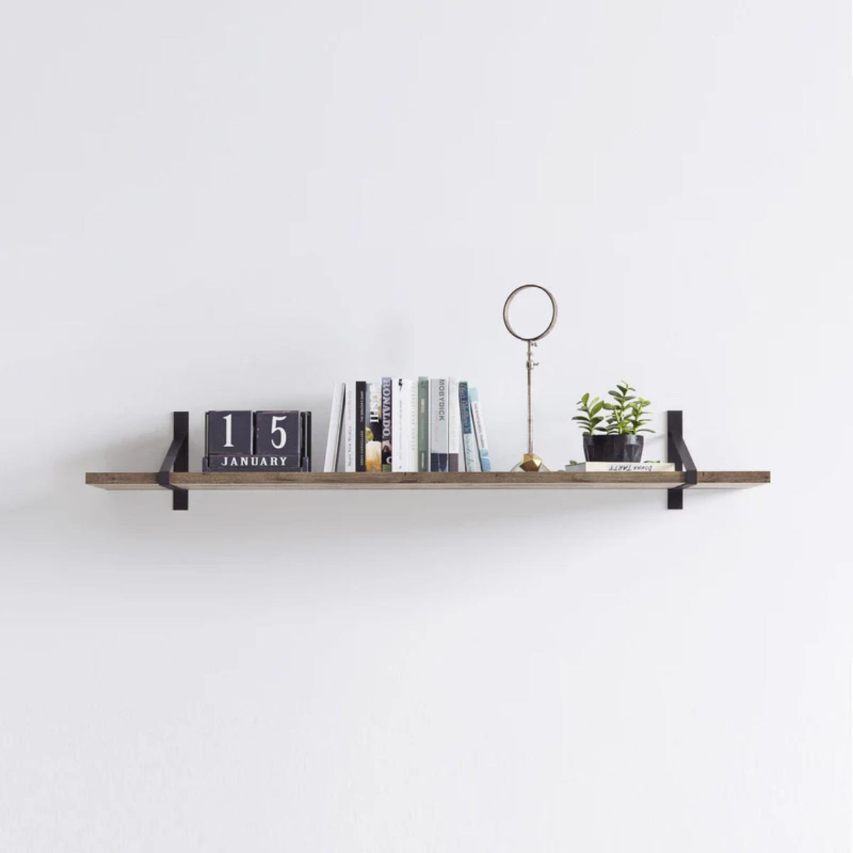 Suspense shelf brackets, black finish, wall shelf styled with books