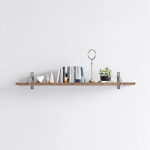 Suspense shelf brackets, raw steel, long shelf with books and decor