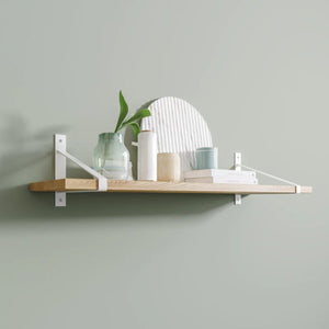 Suspense shelf brackets, white, wall shelf with decor on green wall