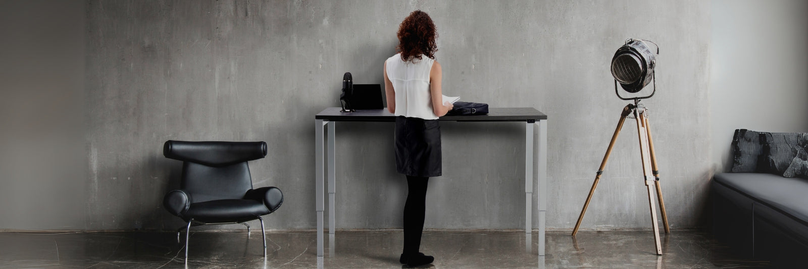 What are the Advantages of Standing Desks - Woman standing in front of the Standing Desk