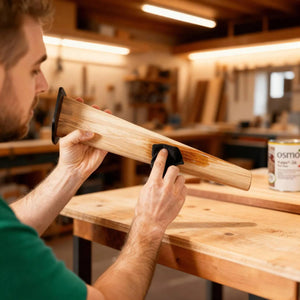 Wooden Desk Legs - Tapered Legs 71cm No Finish - Man oiling the wooden leg