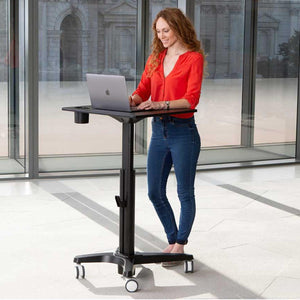 Yo-Yo Learn Adjustable Mobile Standing Desk - Woman using the Black Variant of Standing Desk