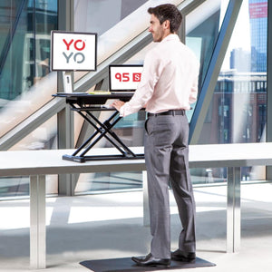 YoYo Desk 95 S - Man Using the Desk While Standing - Black Colour - Height Adjusted