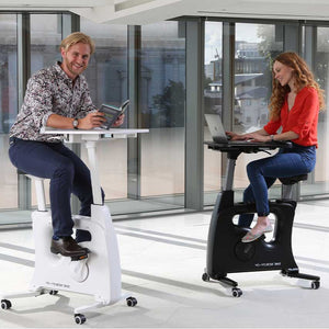 YoYo Desk Bike - Both Man and Woman using the Black and White Variants of Desk Bike