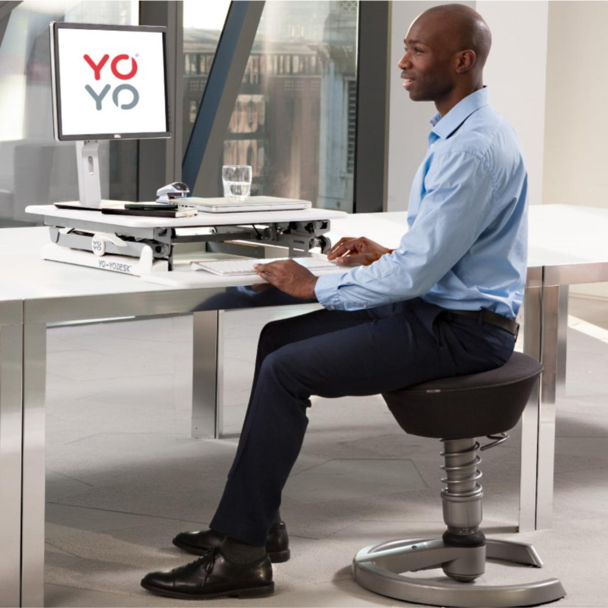 YoYo Desk Mini - Man Using the White Colour Variant of Desk Mini while Typing