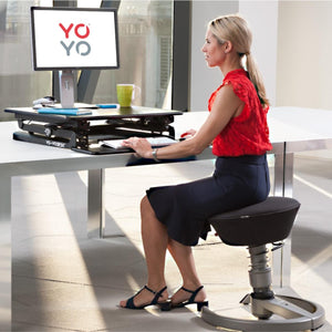 YoYo Desk Mini - Woman Using the Black Colour Variant of Desk Mini while Typing