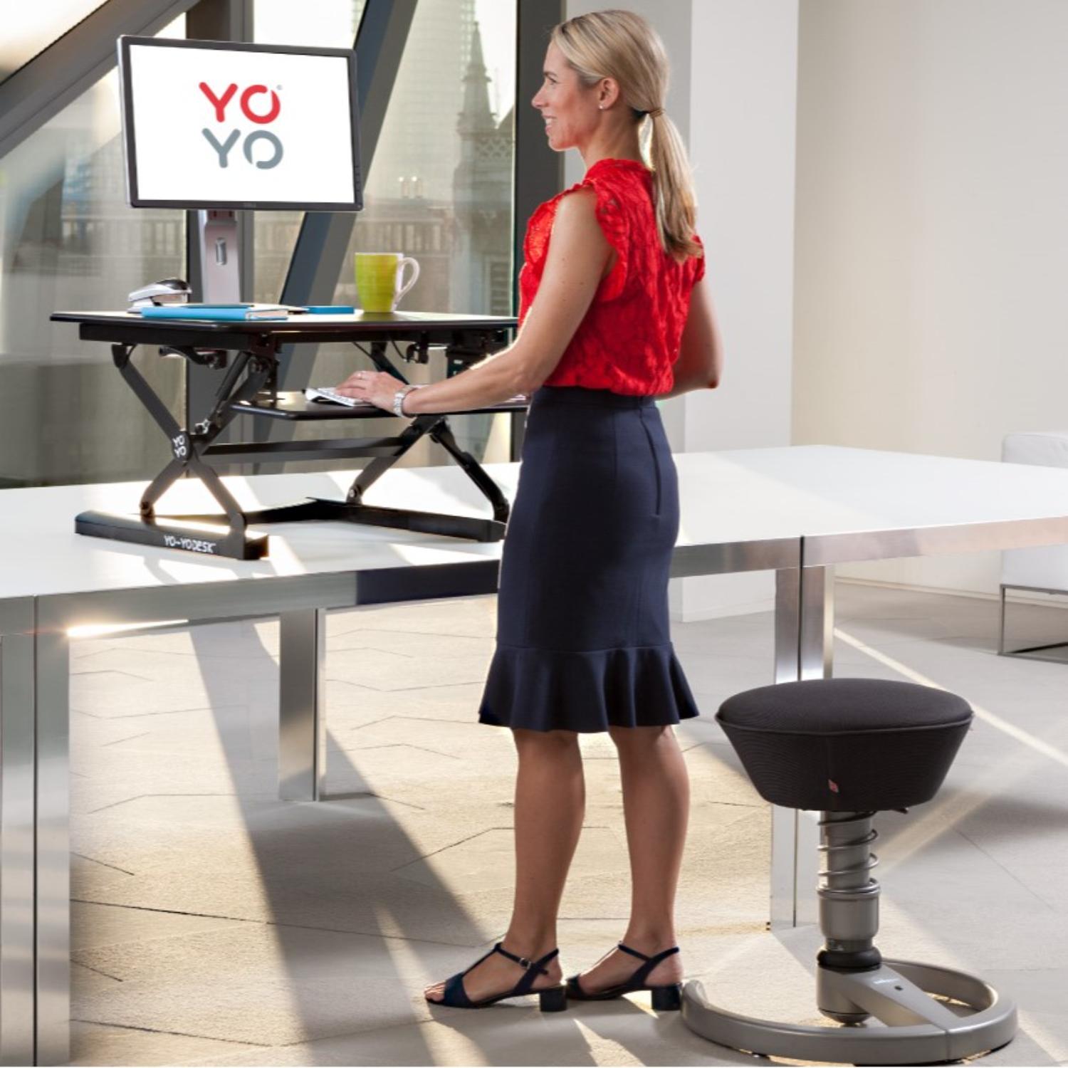 YoYo Desk Mini - Woman Using the Black Colour Variant of Desk Mini