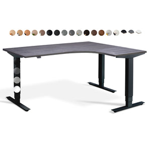Masta corner radial standing desk available in multiple top and frame finishes