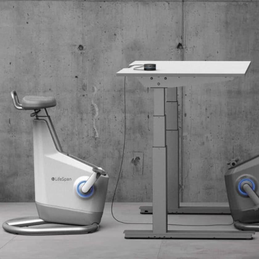 Lifespan Ampera under desk bike at a standing desk taken from side