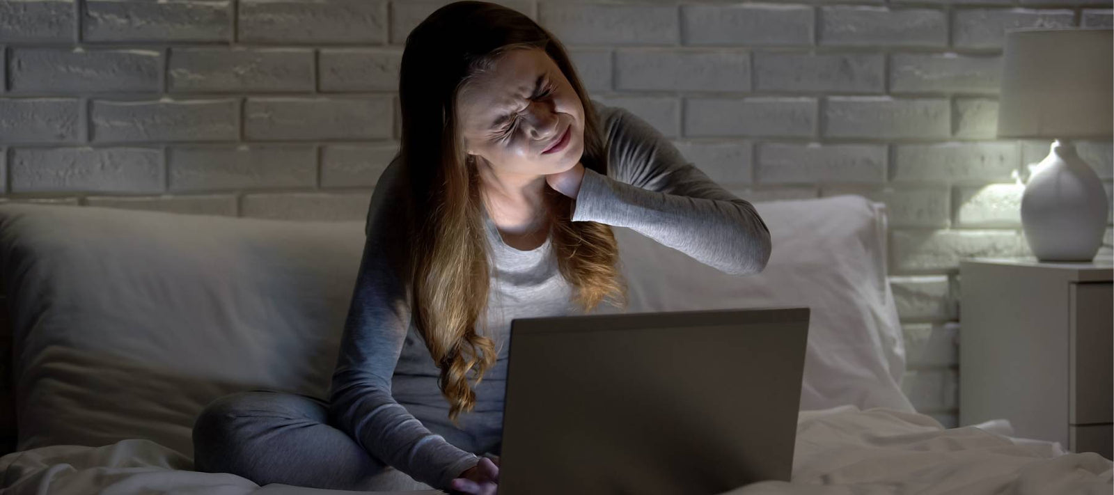 Woman suffering neck pain due to sedentary working lifestyle