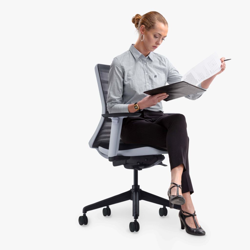 woman sitting in Koplus Tonique task chair left side view