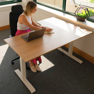 using small corner sit stand desk in office front view