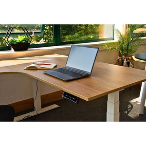 oak surface of small corner sit stand desk viewed from side