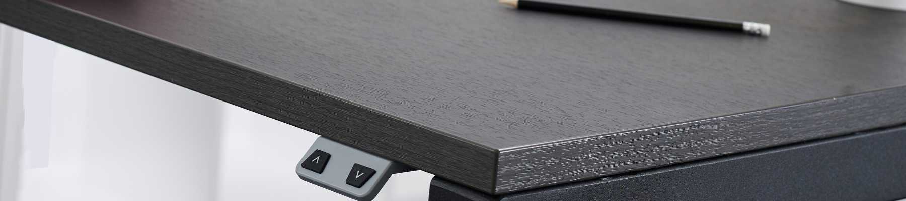 sit stand desk top in anthracite sherman oak finish in close up viewed from side