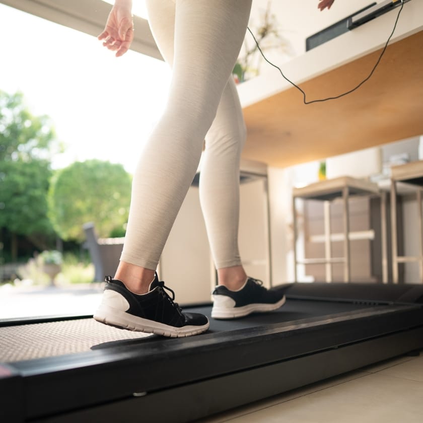 Walking on an under desk treadmill at a standing desk