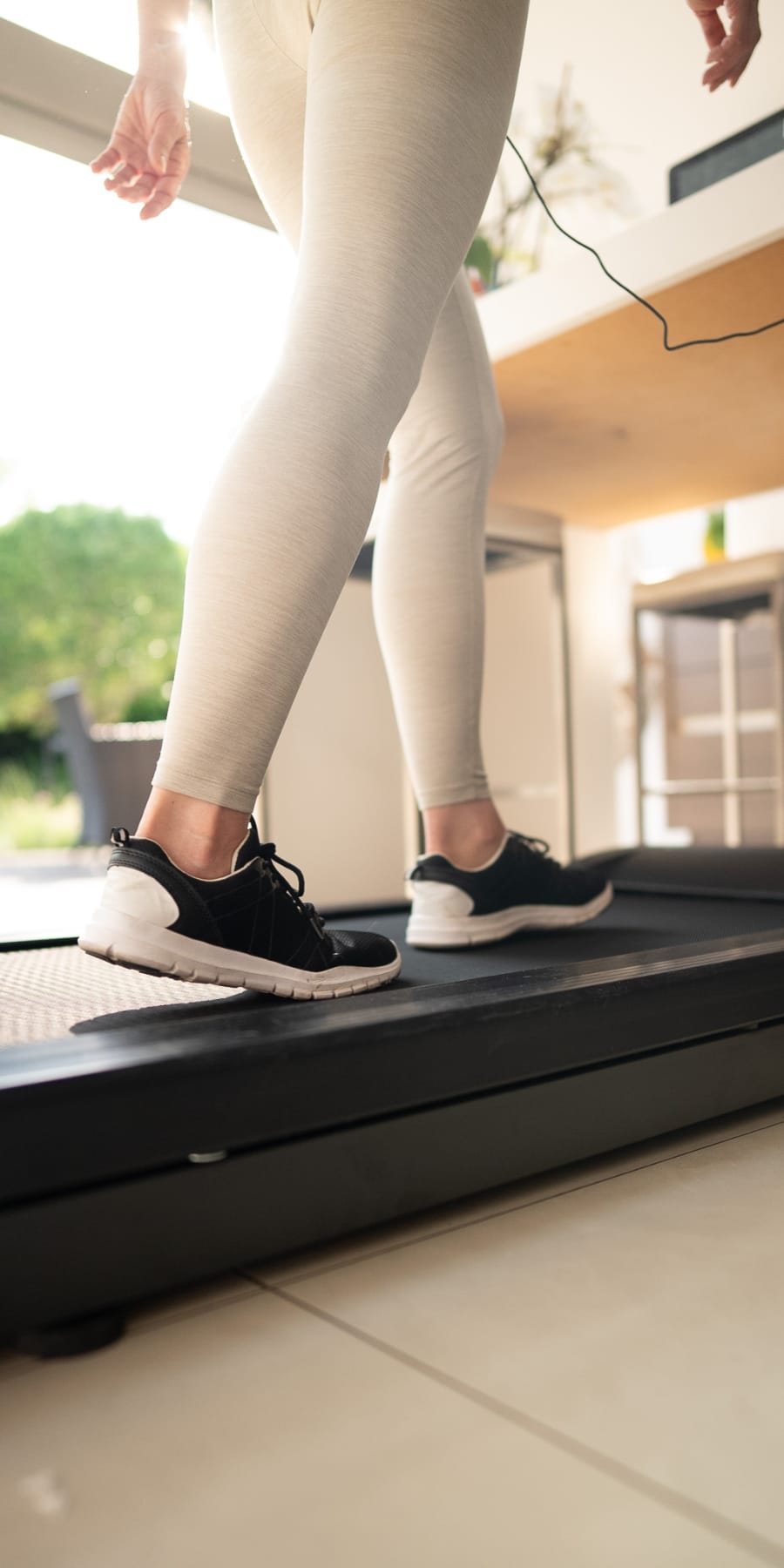 Walking on an under desk treadmill at a standing desk